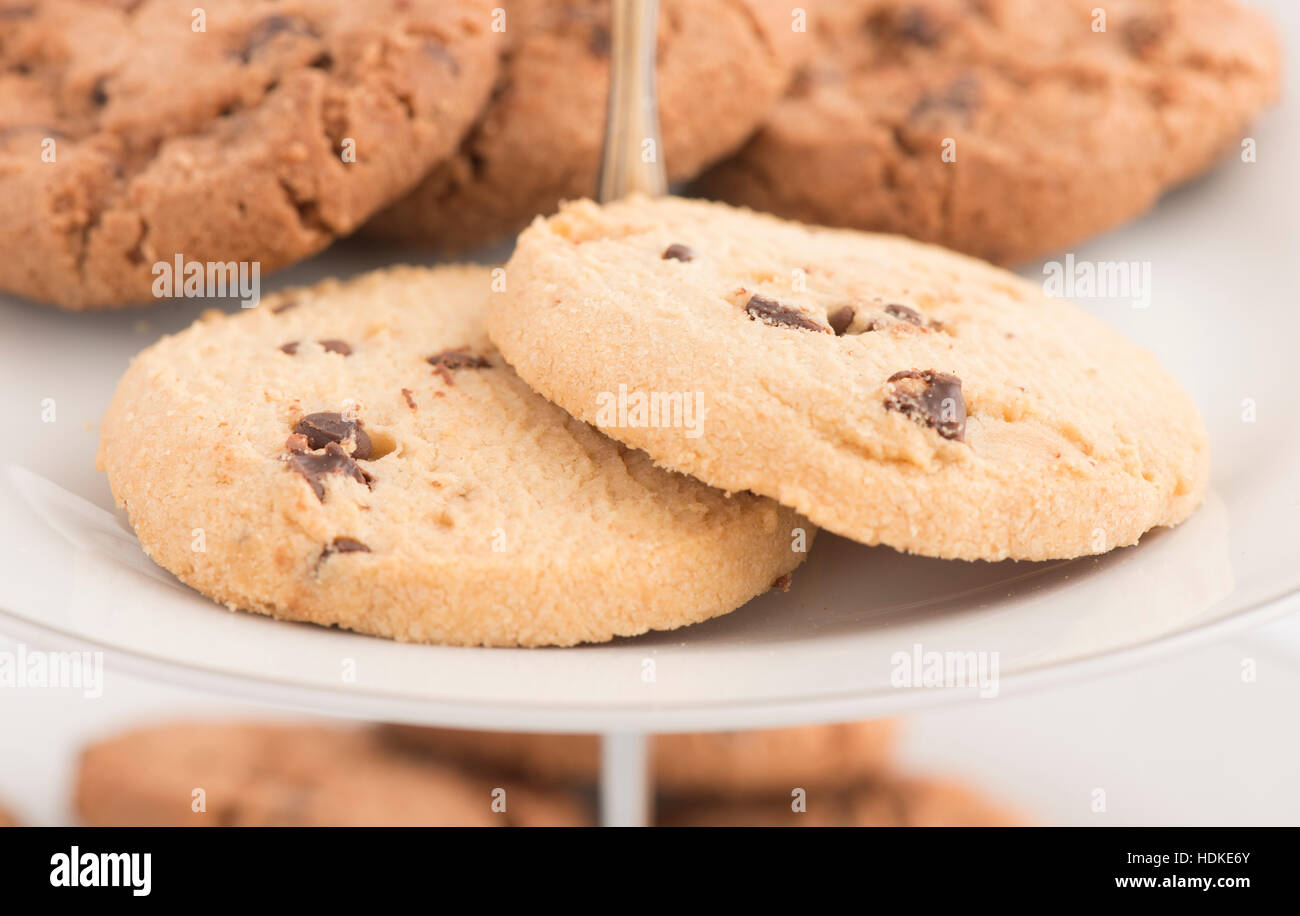 Chocolate chip cookies on plate in close up. Sweet food, dessert or snack. Stock Photo