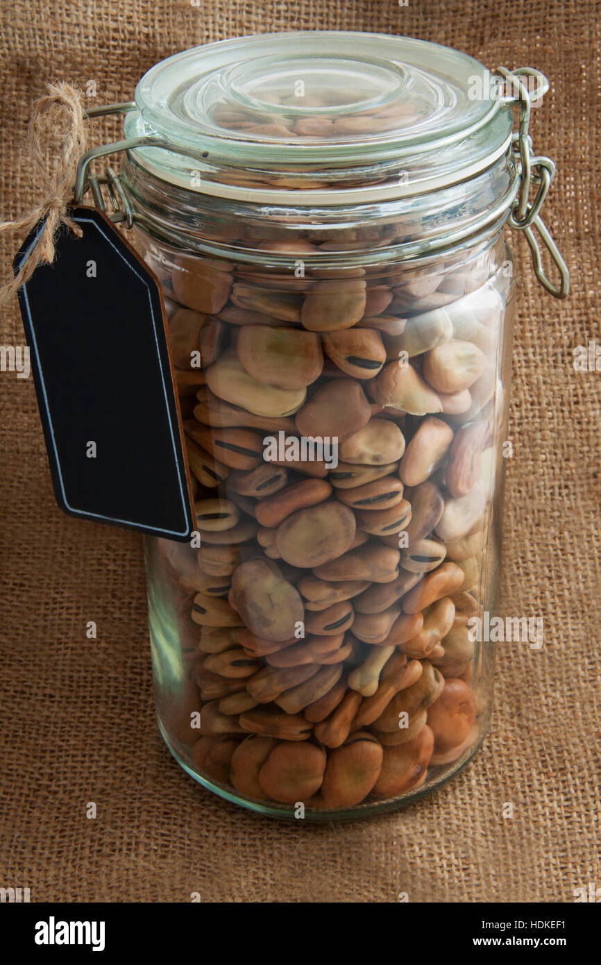 Beans in glass jar and on jute cloth for background use Stock Photo Alamy