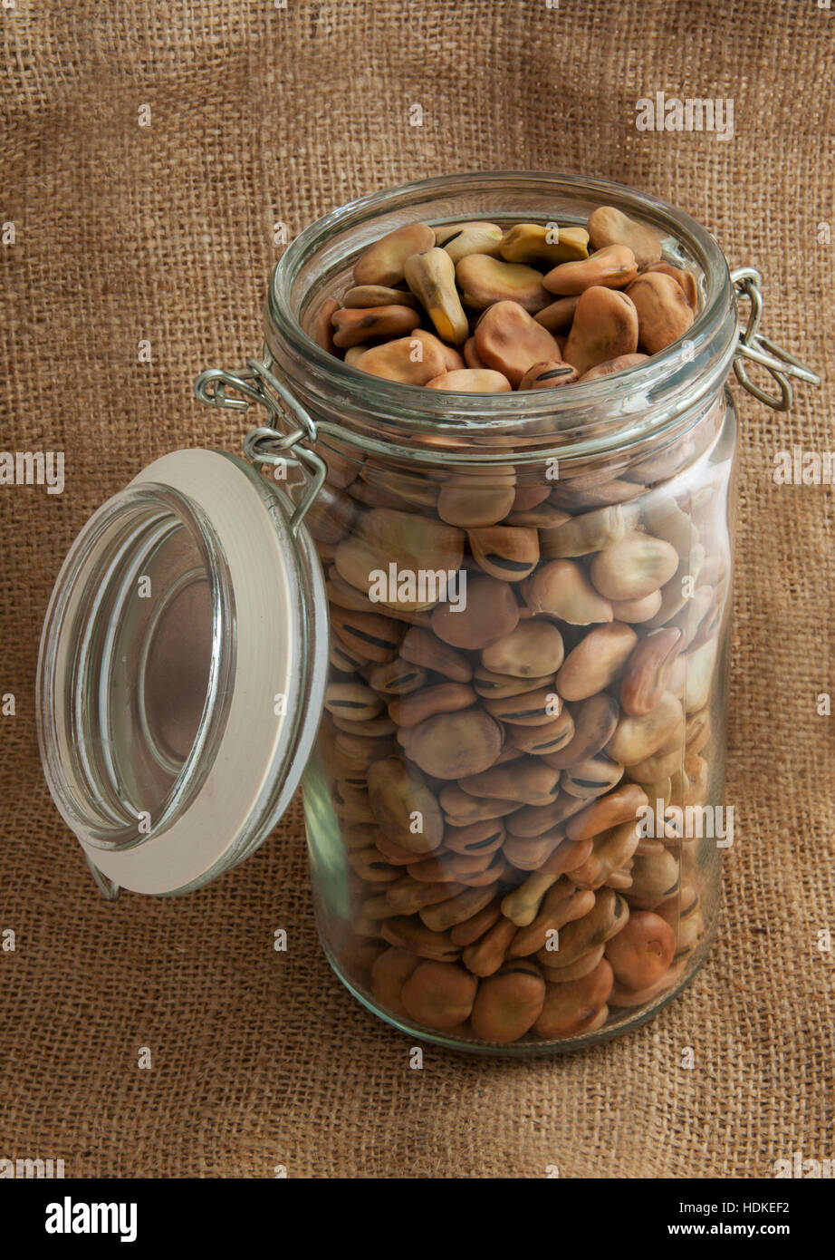 Beans in glass jar and on jute cloth for background use Stock Photo Alamy