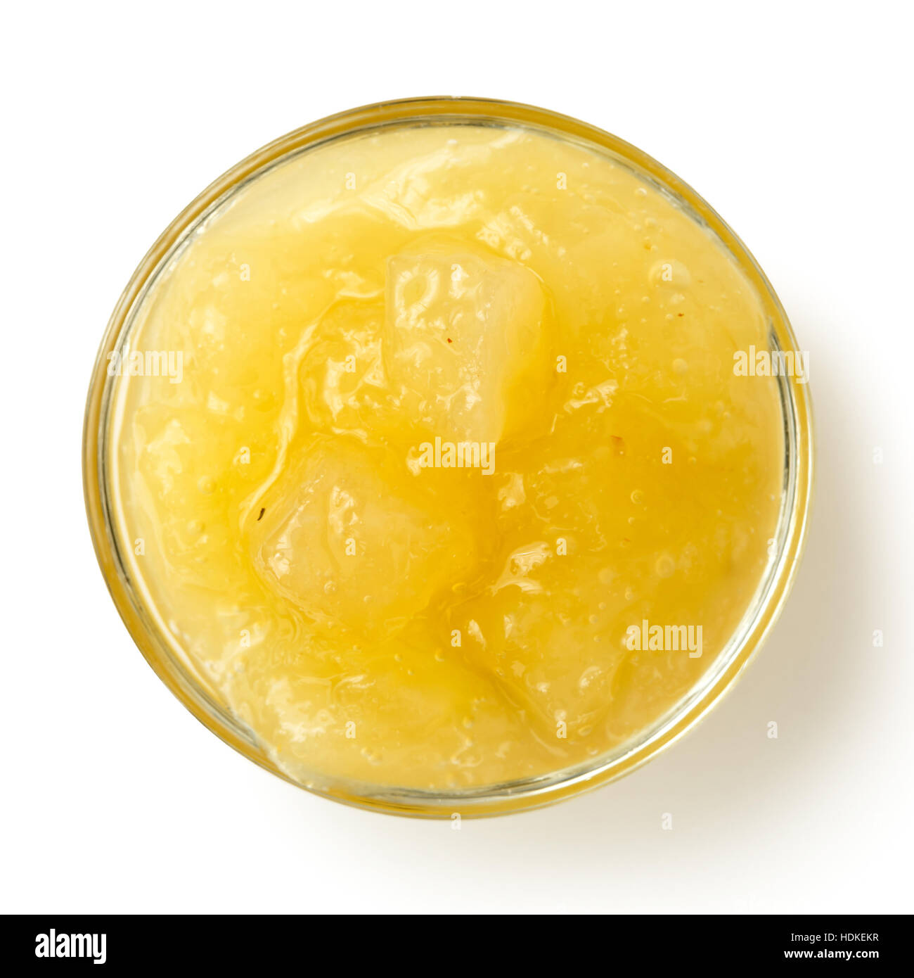 Bramley apple sauce in glass bowl isolated on white from above. Stock Photo
