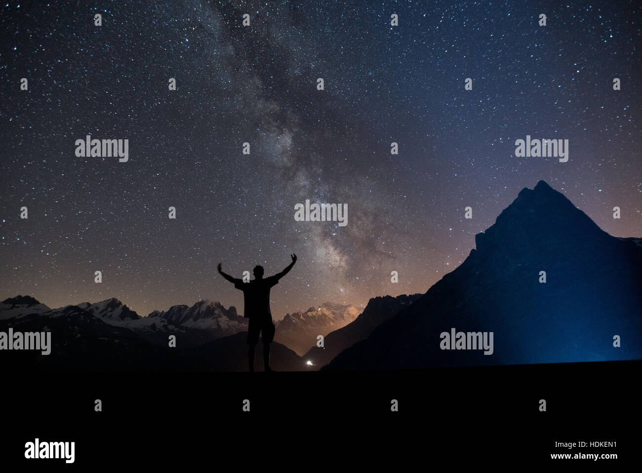 Milky Way. Night sky with stars and silhouette of a man Stock Photo - Alamy