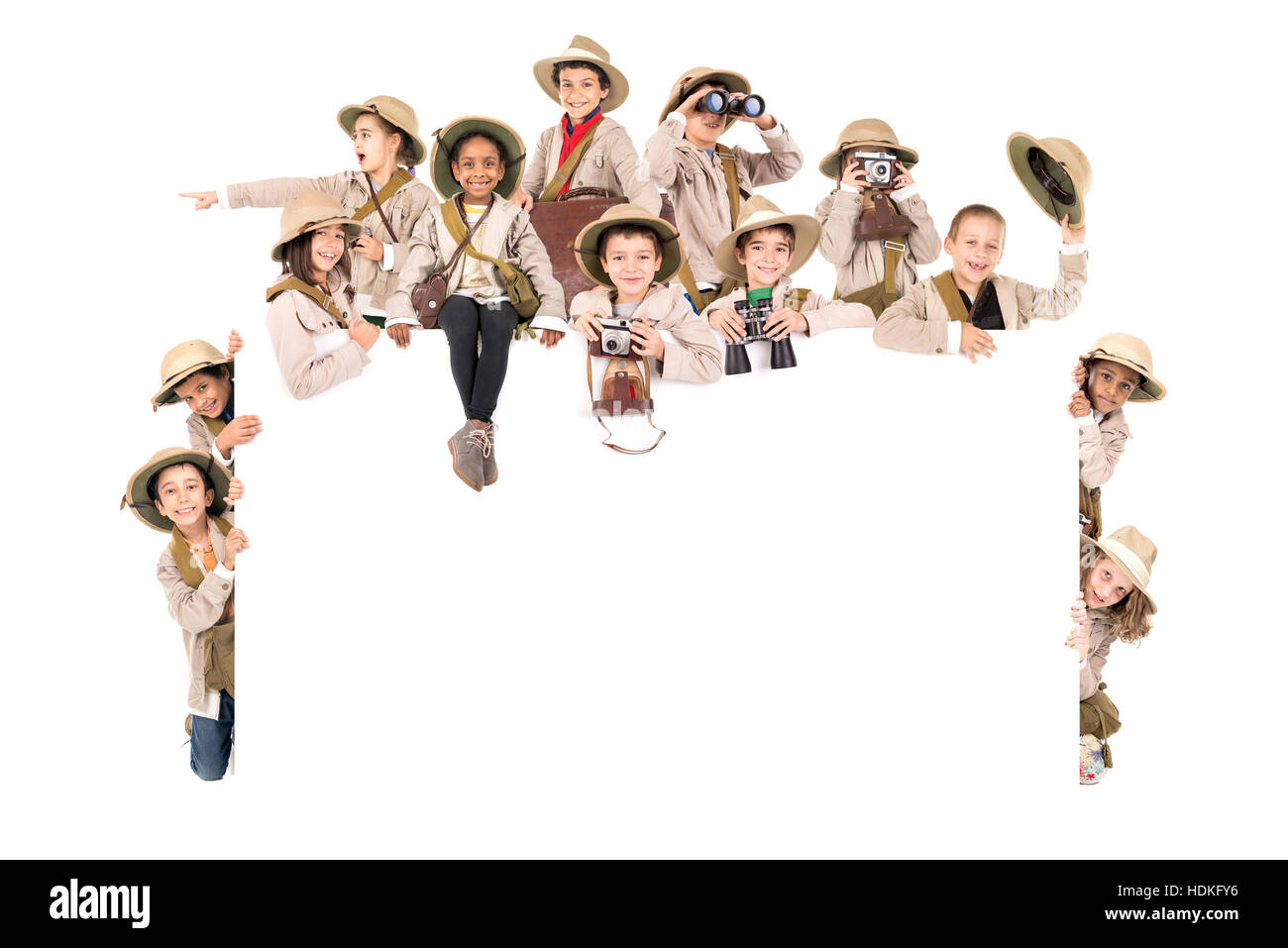 Children's group with safari clothes and gear over a white board Stock ...