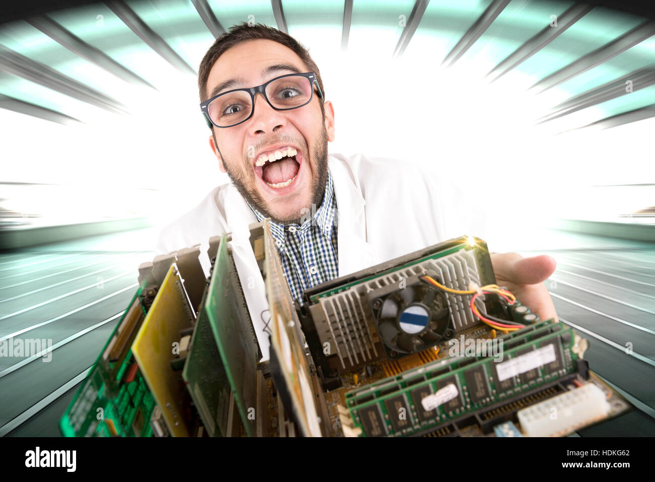 Happy nerd engineer posing with computer components Stock Photo