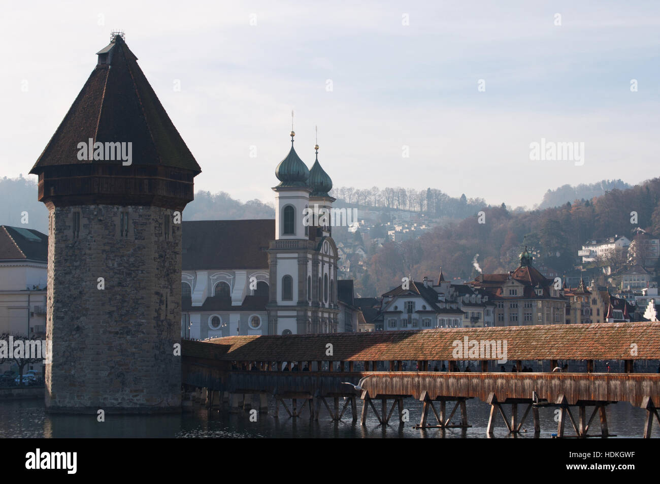 Lucerne, Switzerland, Europe: skyline of the medieval city with view of the Water Tower, the Chapel Bridge and the Jesuit Church Stock Photo