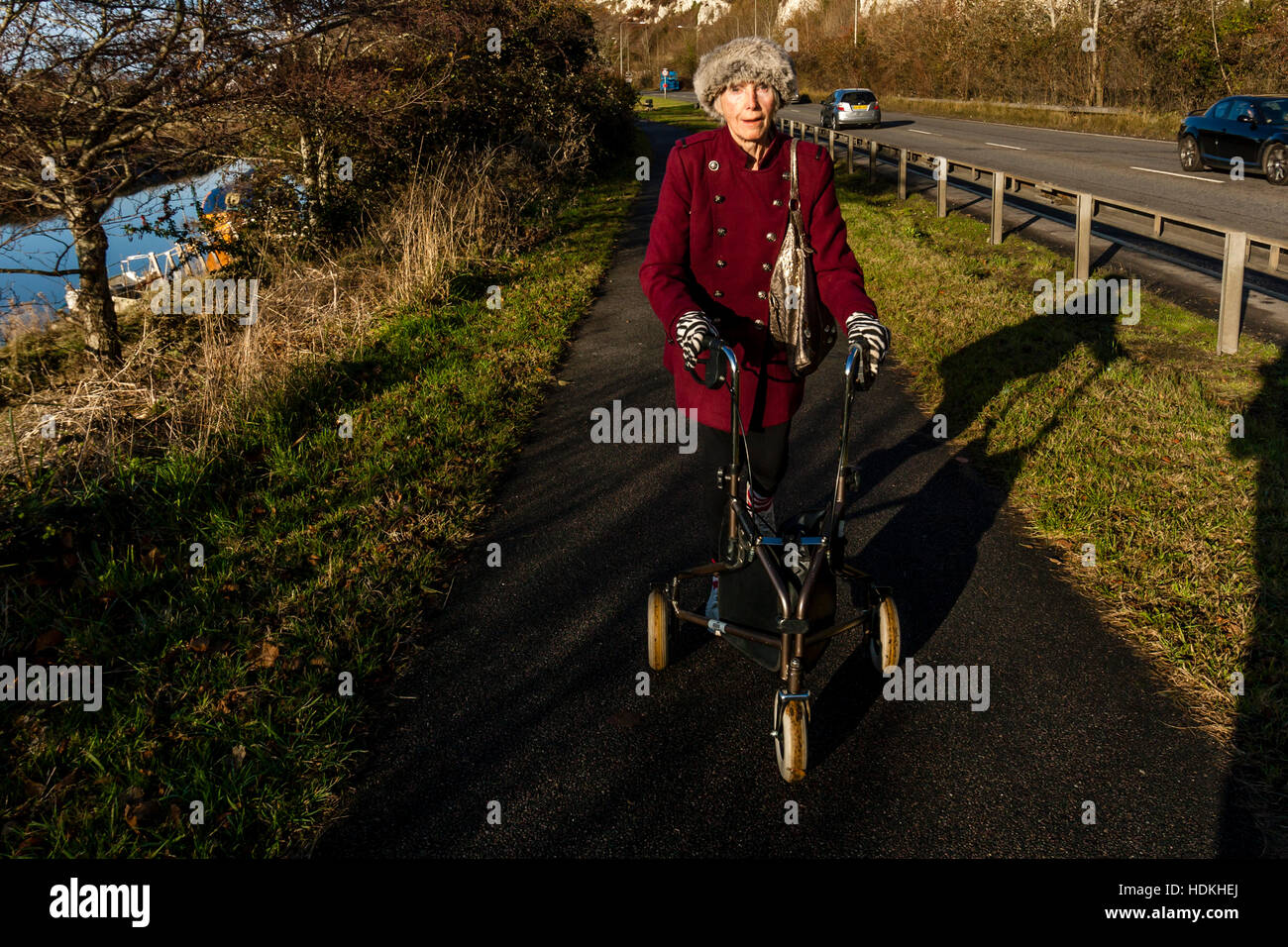 An Elderly Disabled Woman Walking With Her Rollator, Lewes, Sussex, UK Stock Photo