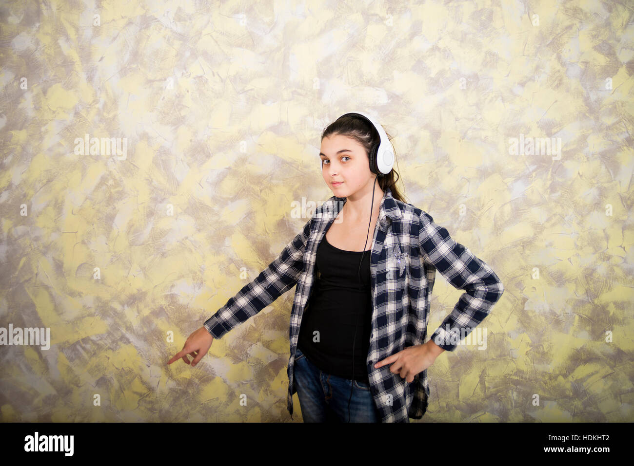 Pretty girl in plaid shirt with headset Stock Photo