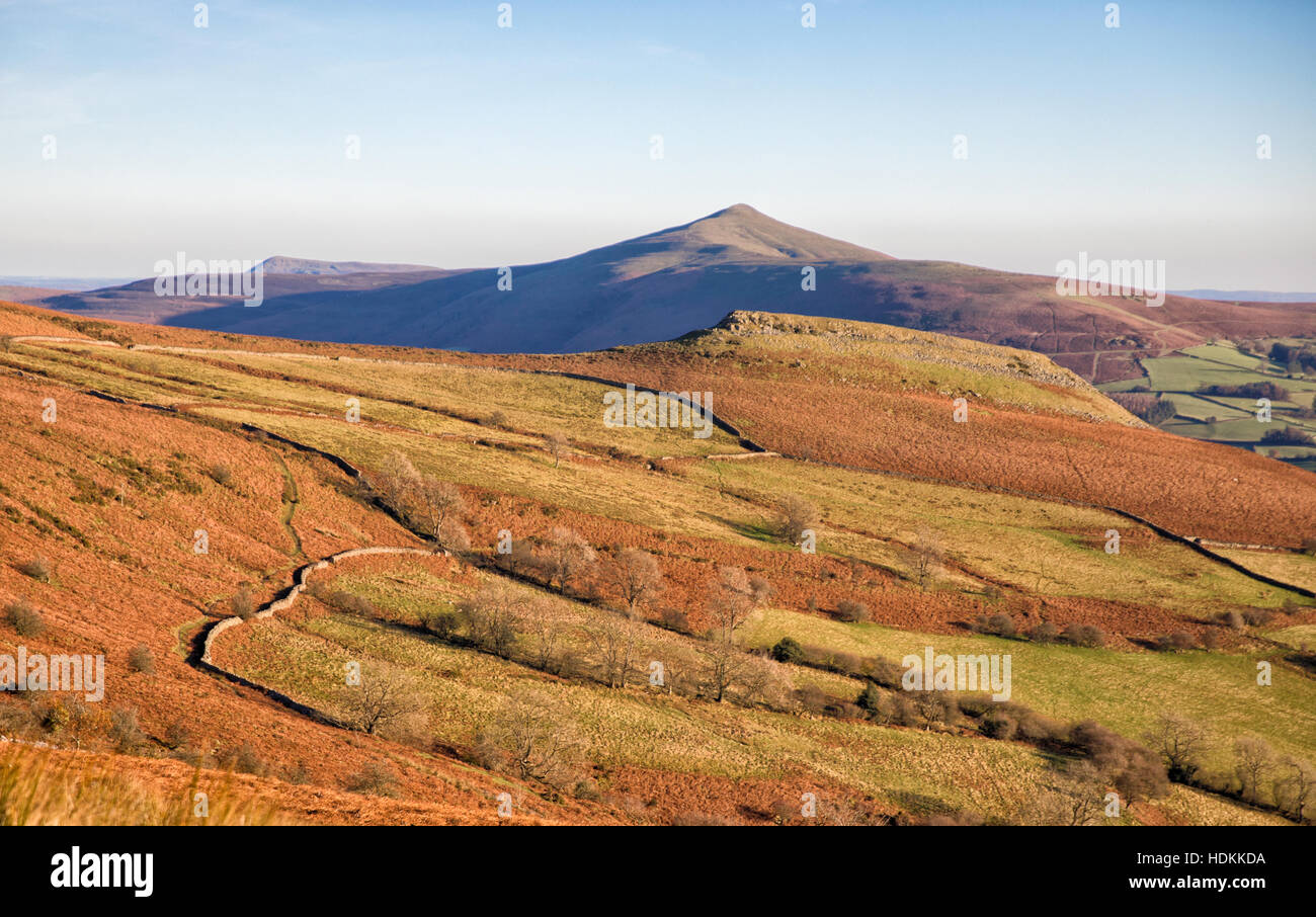Table Mountain or Cryg Hywel with the Sugarloaf mountain beyond from above the town of Crickhowell in the Brecon Beacons Wales Stock Photo