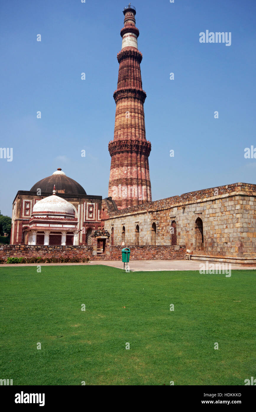 Qutb Minar. Ancient islamic victory tower in landscaped gardens in