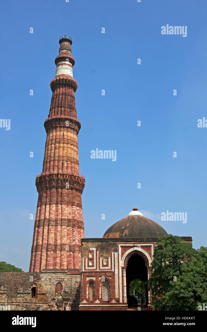 Qutb Minar. Ancient islamic victory tower in landscaped gardens in