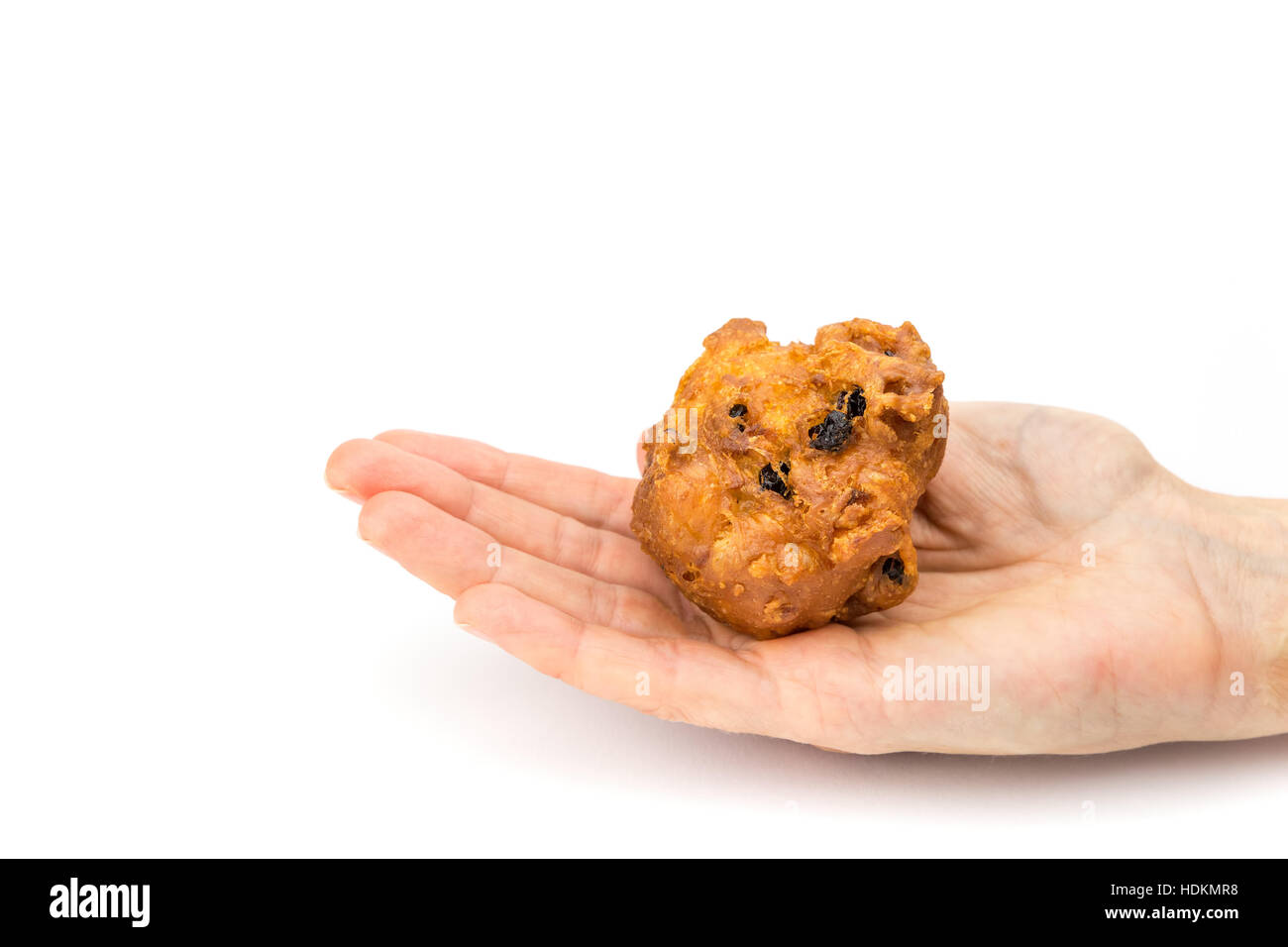 Female hand palm showing fritter or oliebol isolated on white background Stock Photo