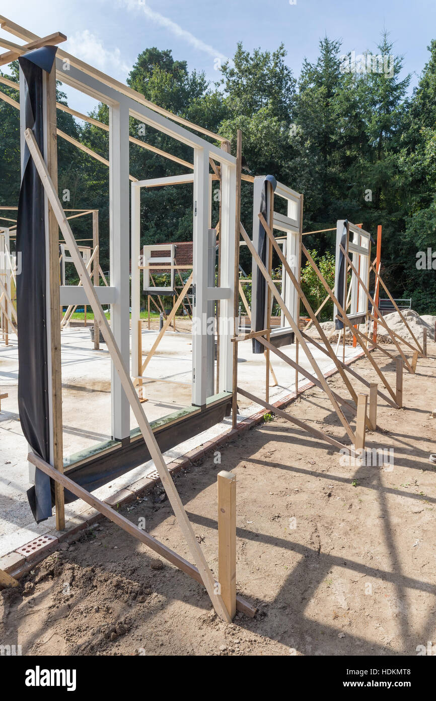 Set vertical window and door frames new house on sunny day Stock Photo