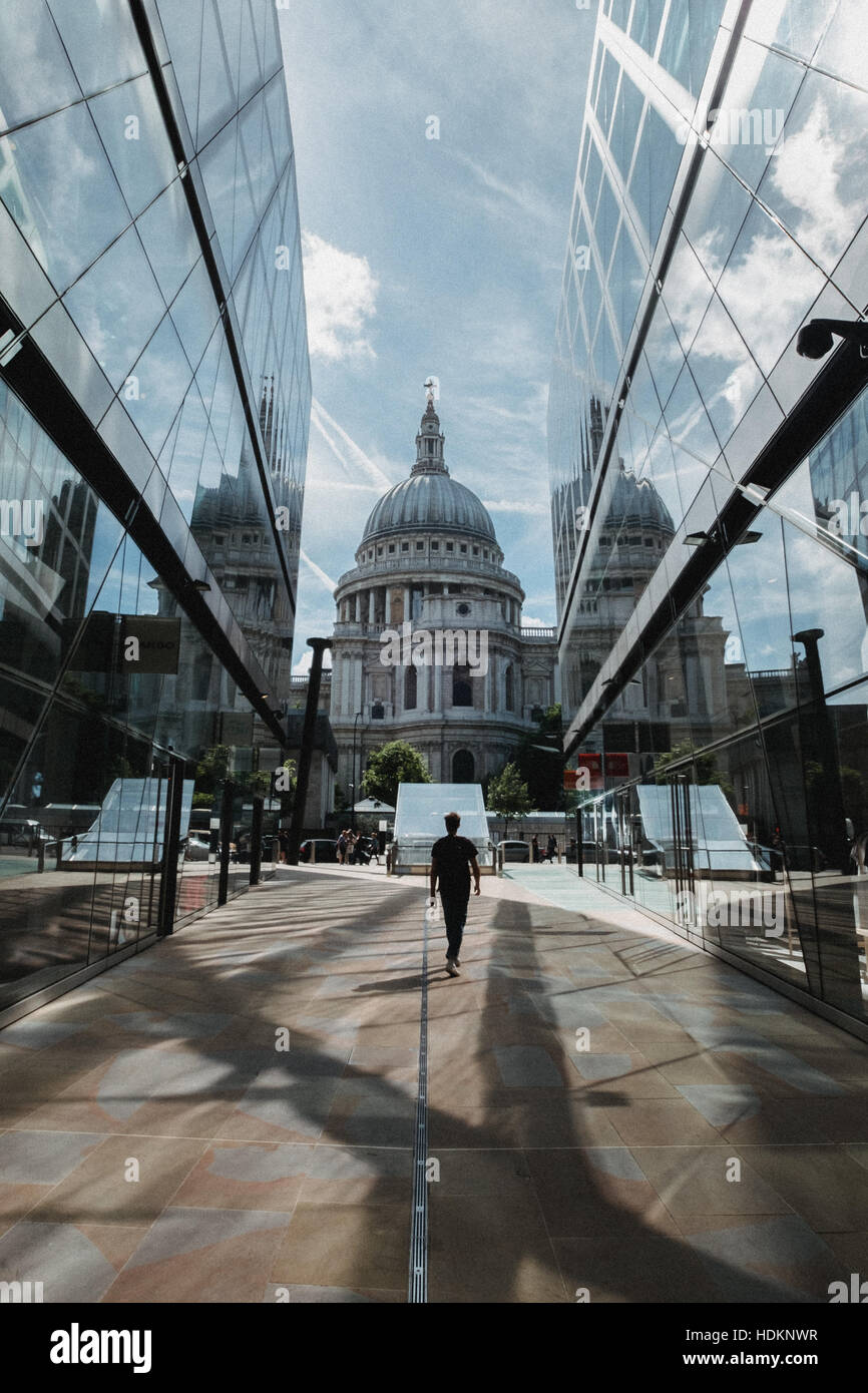 Man walks towards St Paul's Cathedral in London. Stock Photo
