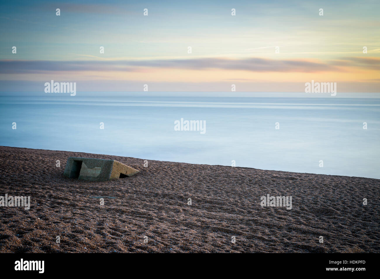 WWII concrete block on Chesil Beach, Dorset, England, UK Stock Photo