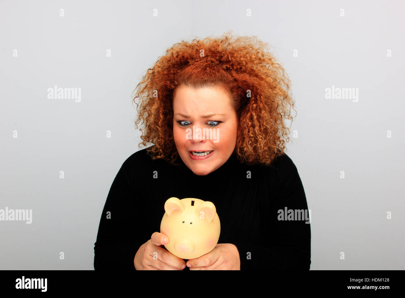 girl holding a piggy bank portrait Stock Photo - Alamy