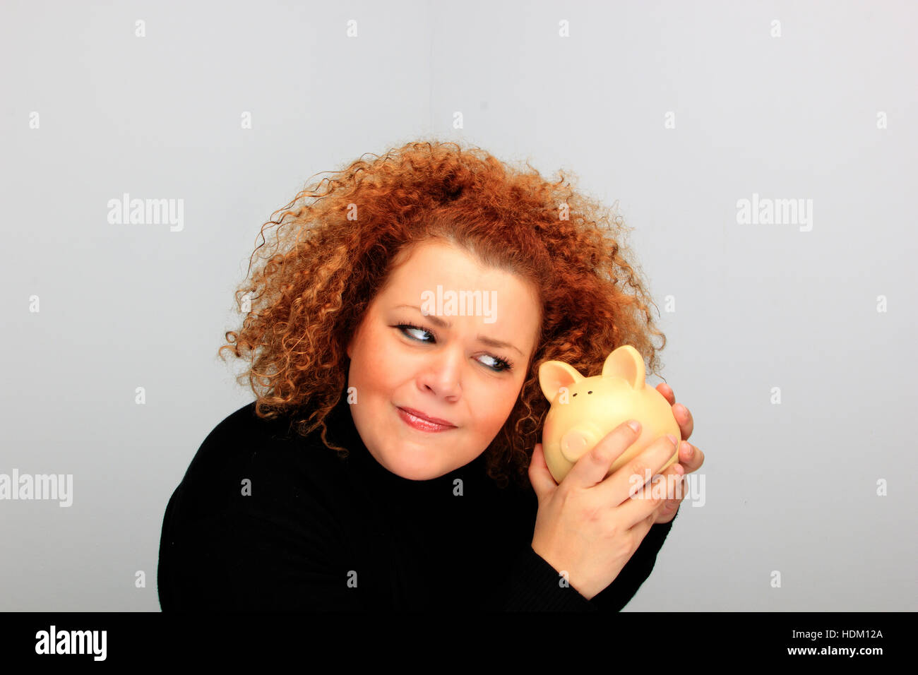girl holding a piggy bank portrait Stock Photo - Alamy