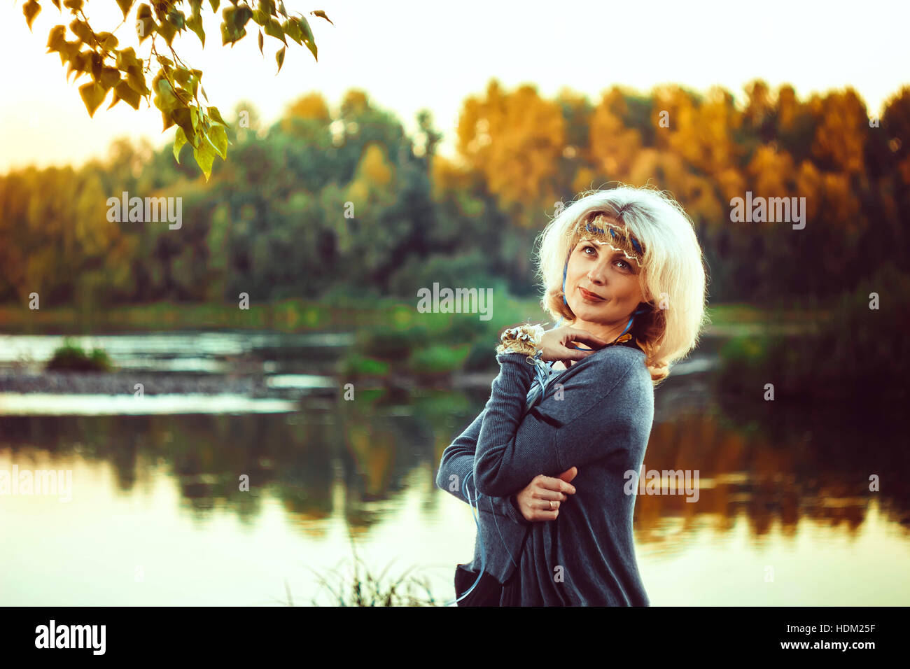 elderly woman at the river Stock Photo - Alamy