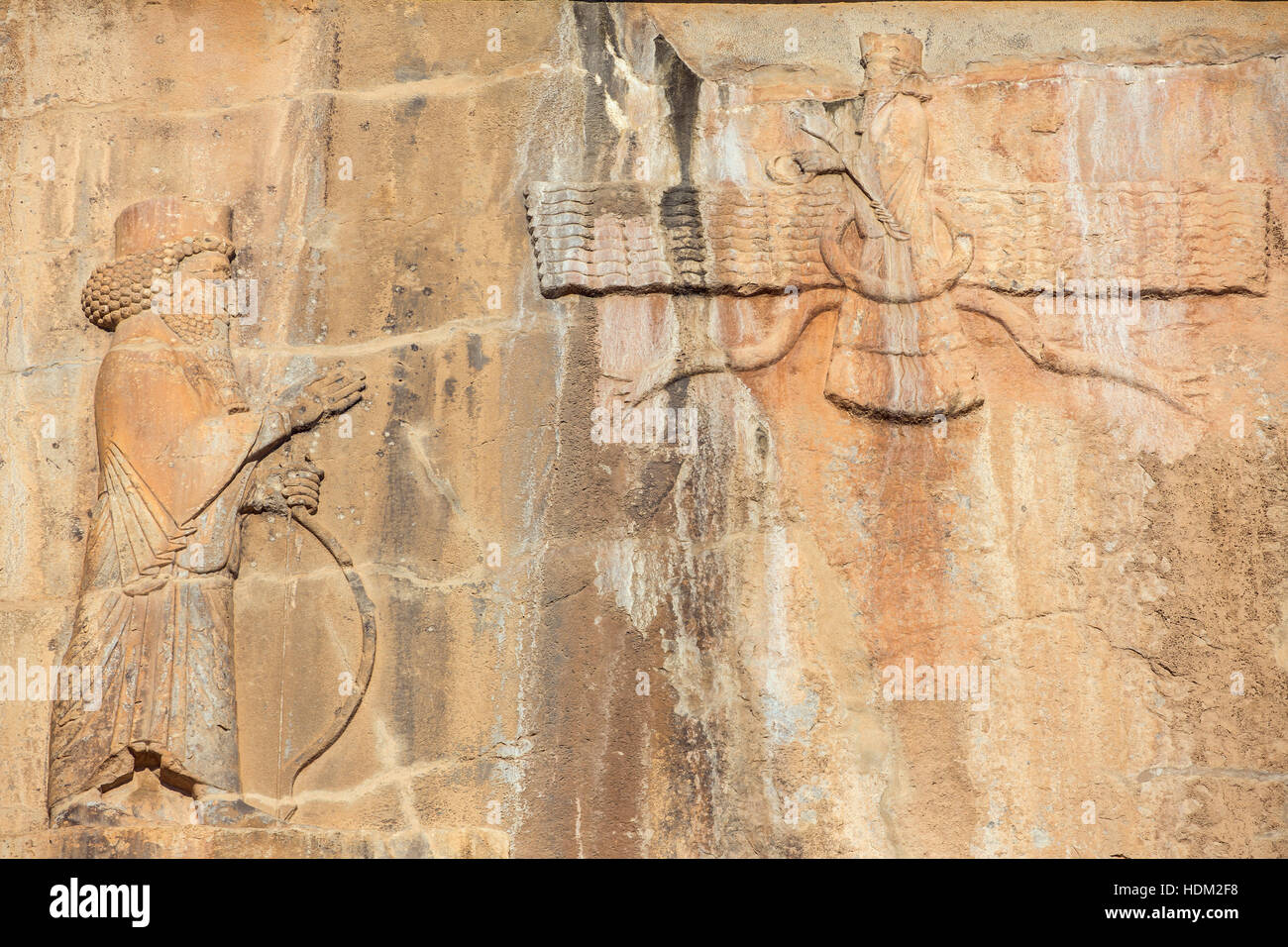 Faravahar - relief of winged sun symbol of Zoroastrianism in ruined Persepolis city Stock Photo