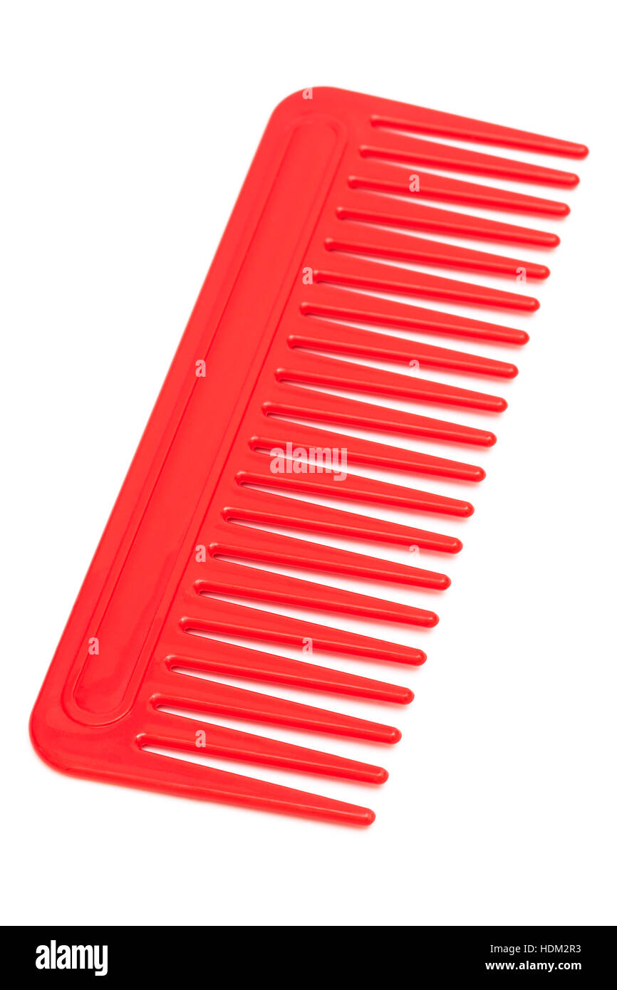 red plastic comb on a white background Stock Photo Alamy