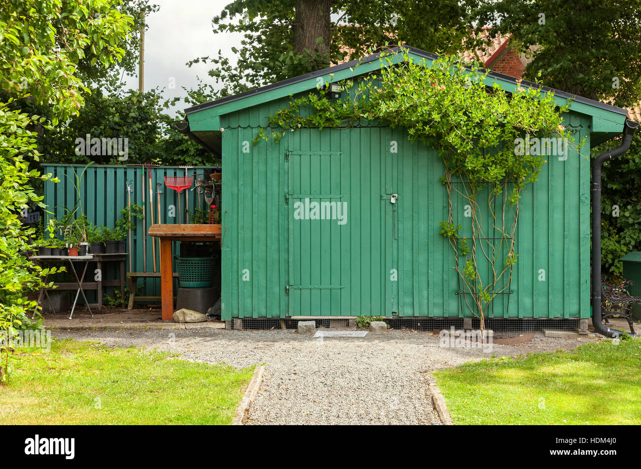 Image of a green garden shed. Stock Photo