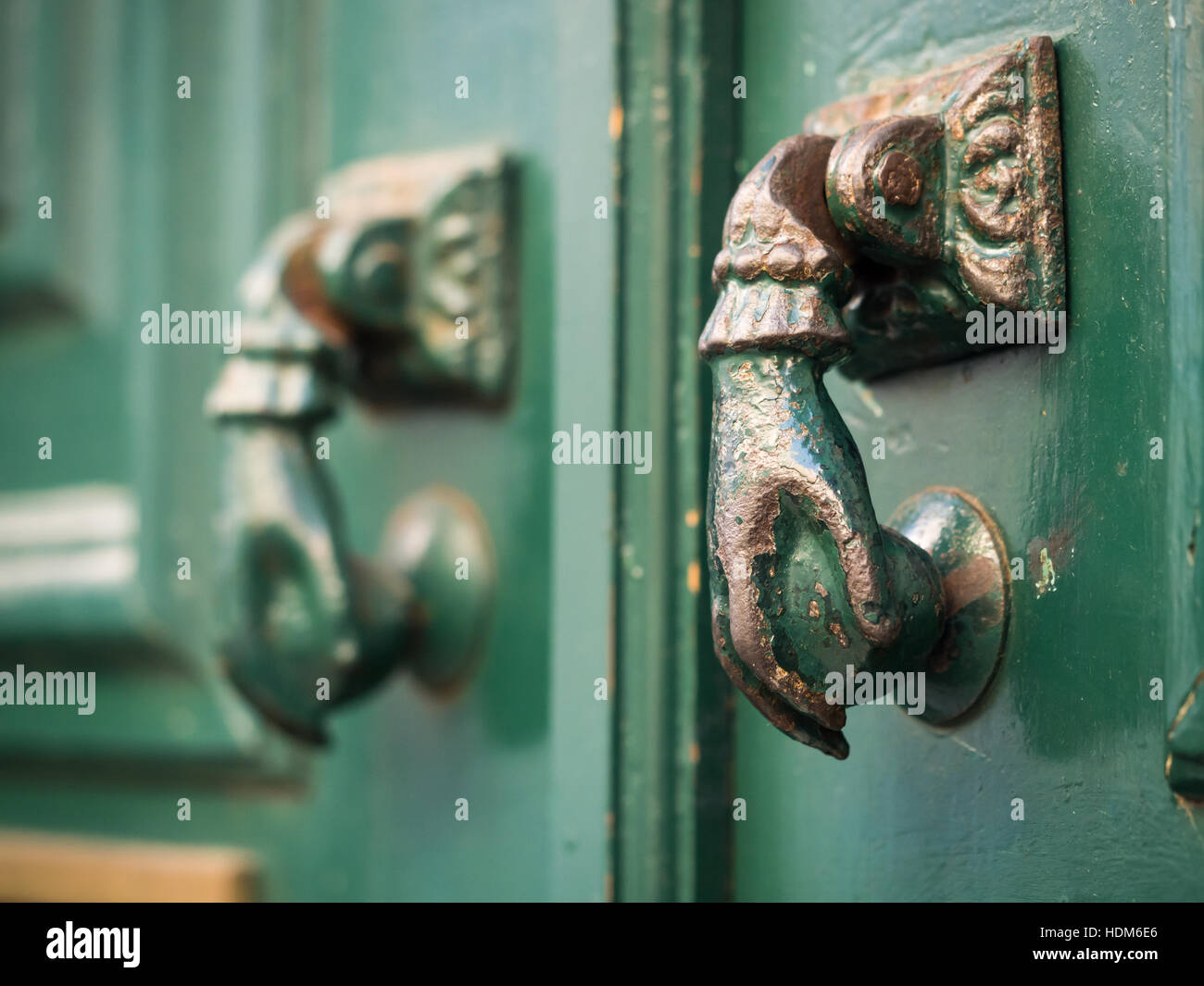 Old hand shaped metal door handles in Bairro Alto, Lisbon, Portugal