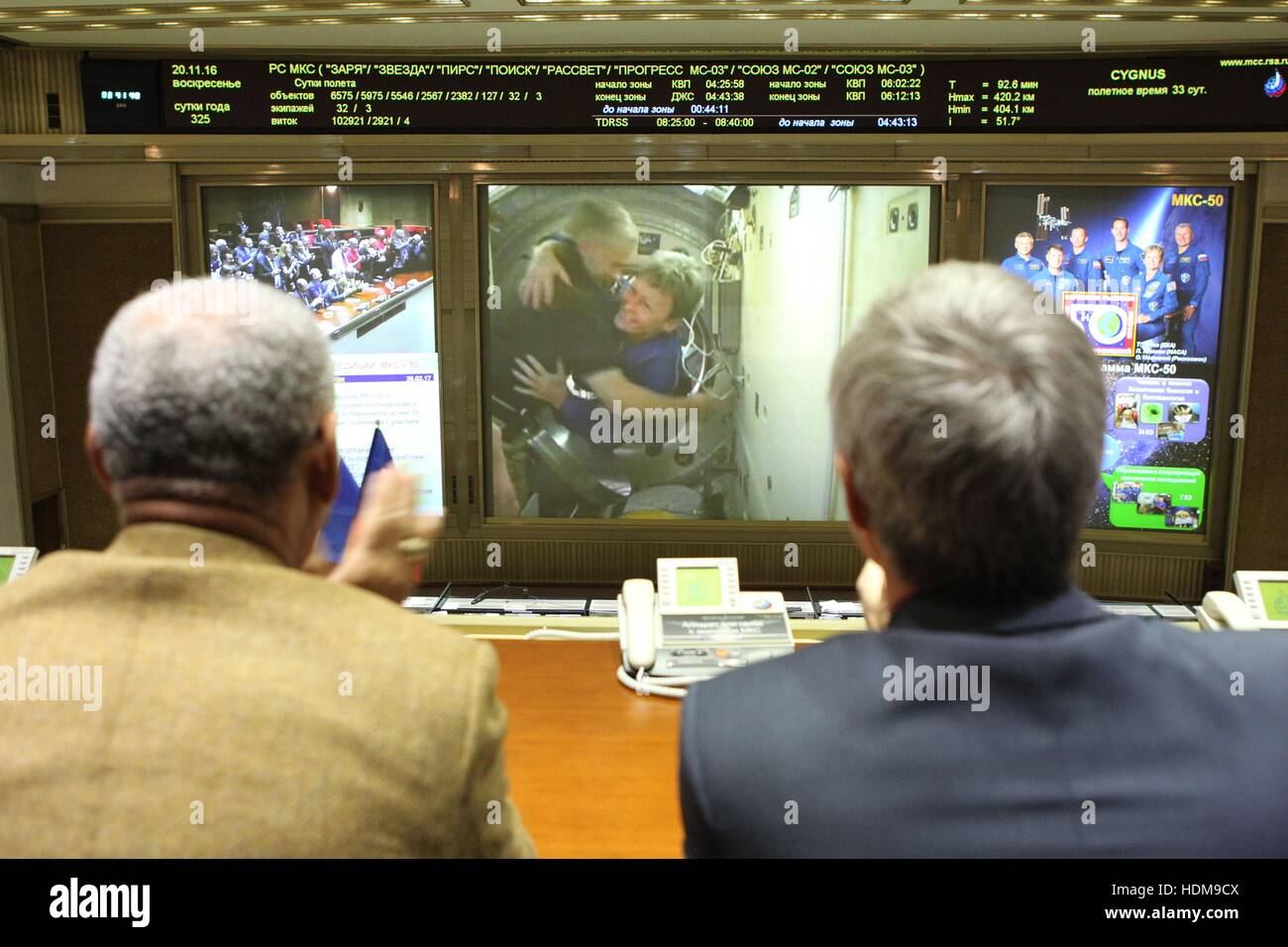 NASA Administrator Charles Bolden (left) and Roscosmos Manager Sergei Krikalev watch Expedition 50-51 prime crew astronaut Peggy Whitson enter the International Space Station following the docking of the Soyuz MS-03 spacecraft at the Russian Mission Control Center November 20, 2016 in Korolev, Russia. Stock Photo