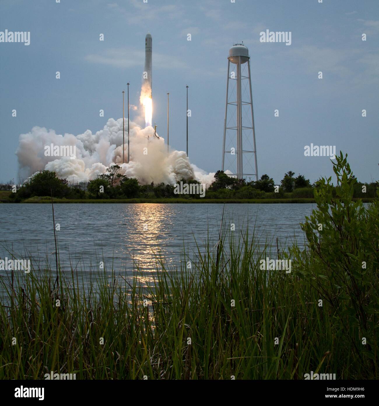 The Orbital Sciences Corporation Antares rocket with Cygnus spacecraft onboard launches from Launch Pad-0A at the NASA Wallops Flight Facility to begin its Orbital-2 cargo delivery flight mission to the International Space Station July 13, 2014 in Chicoteague Island, Virginia. Stock Photo