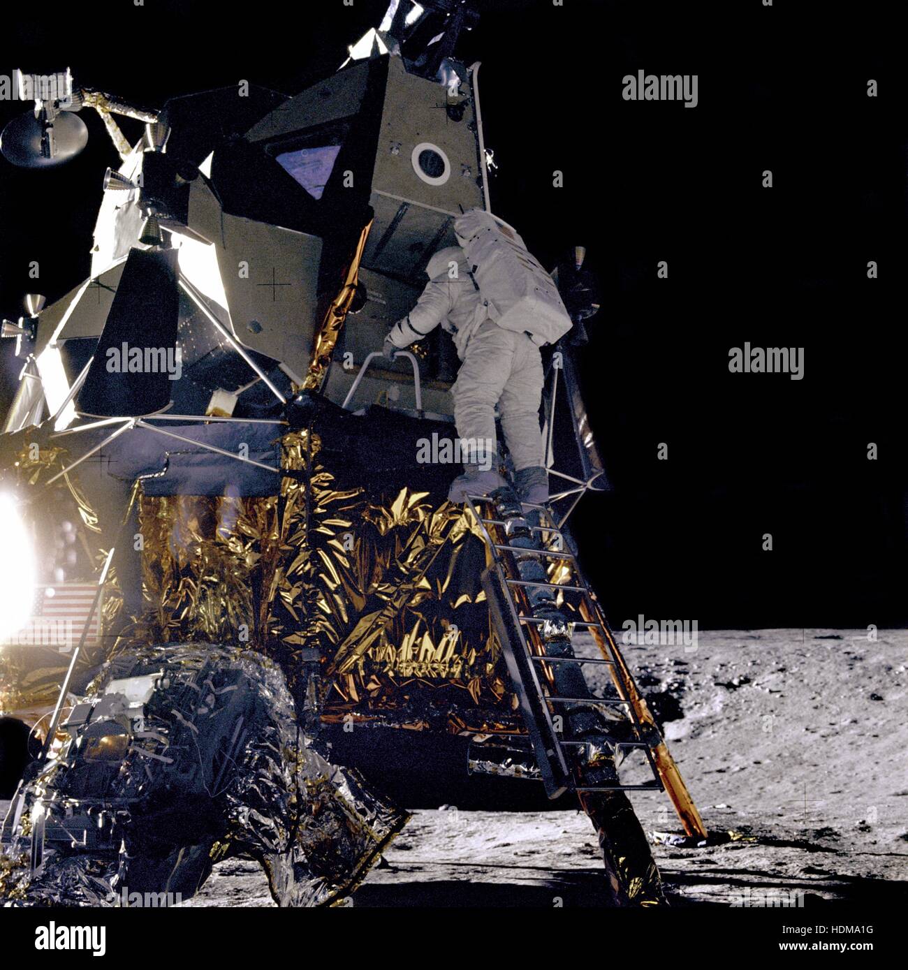 NASA Apollo 12 lunar landing mission astronaut Alan Bean climbs down the ladder of the Lunar Module Intrepid for a spacewalk on the lunar surface November 19, 1969 on the Moon. Stock Photo