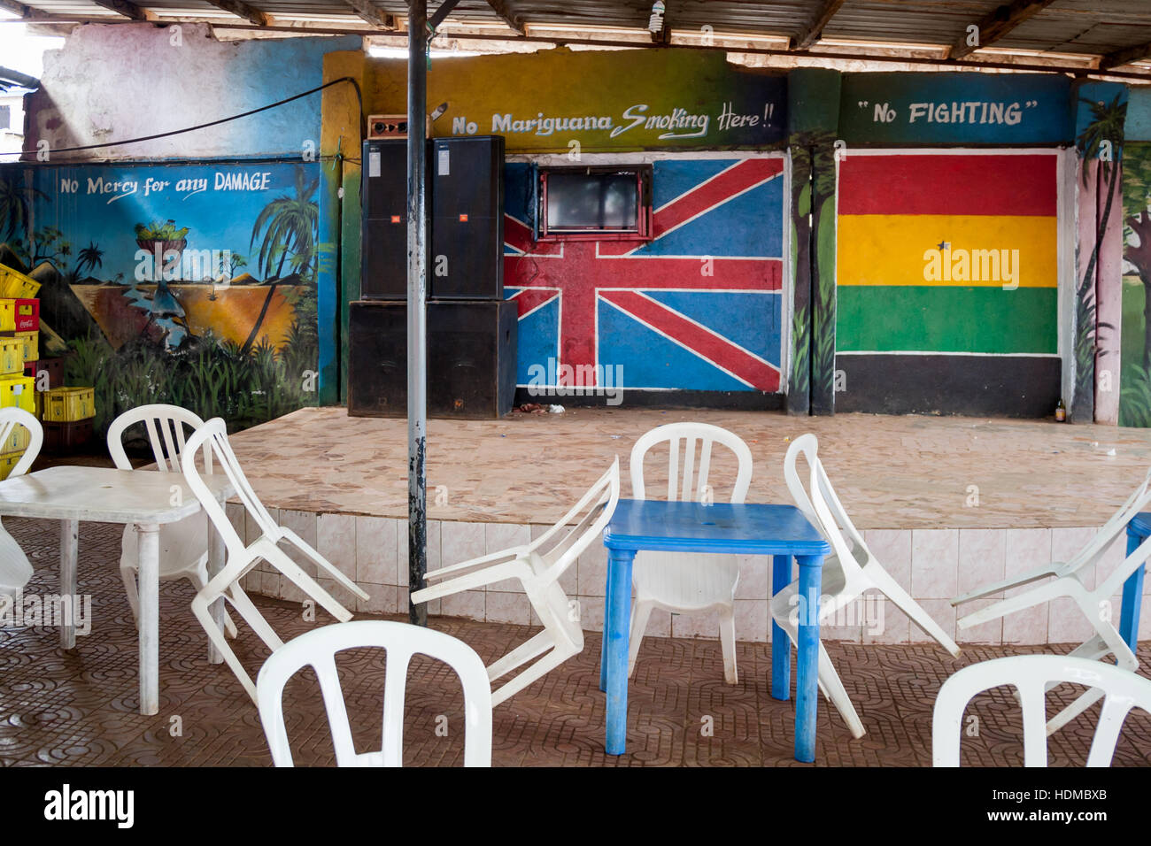 Stage of bar in Sierra Leone. Inscriptions on wall demanding a peaceful attitude and order not to use violence Stock Photo