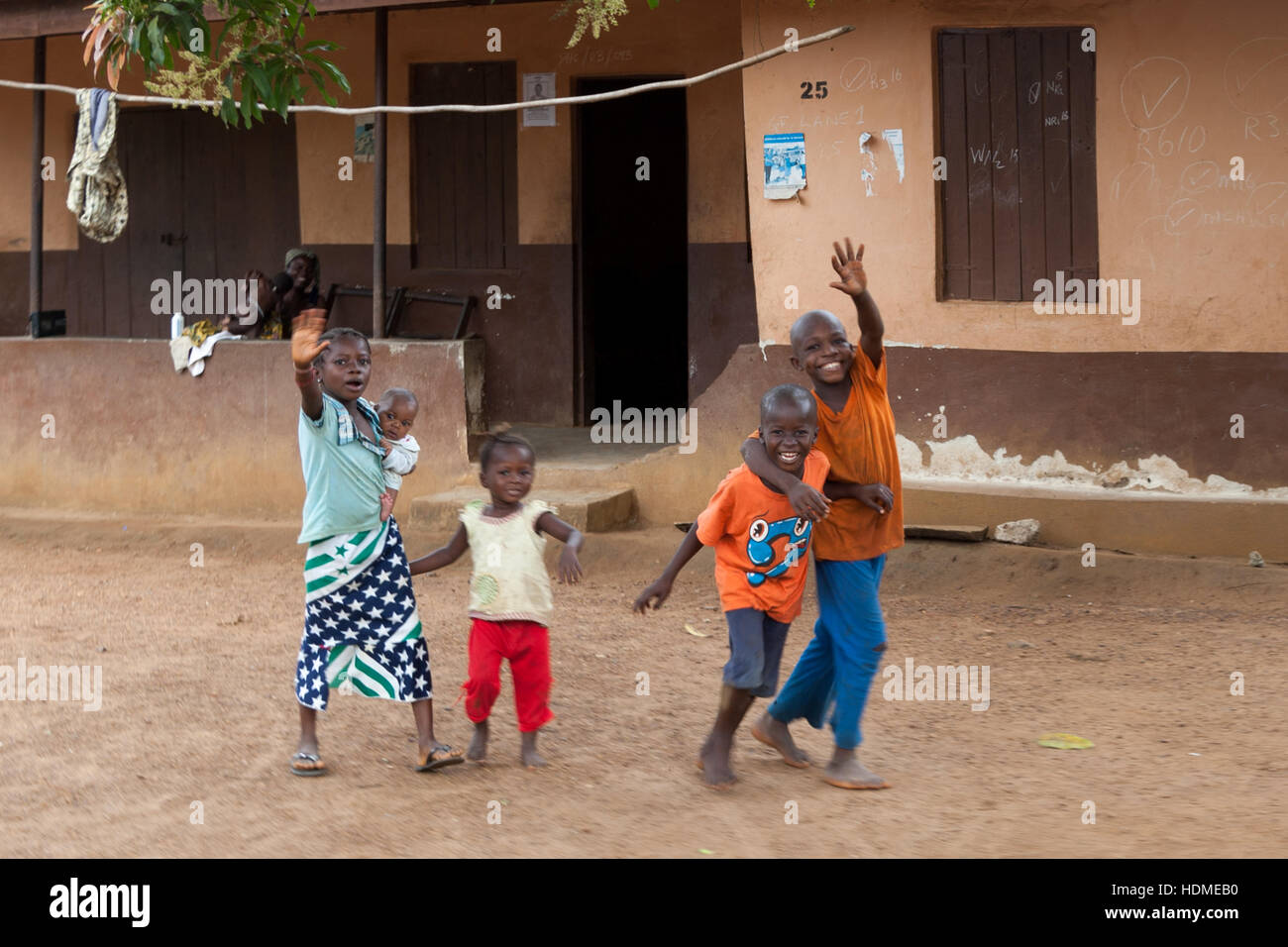 Children in Sierra Leone greeting and waving hands Stock Photo