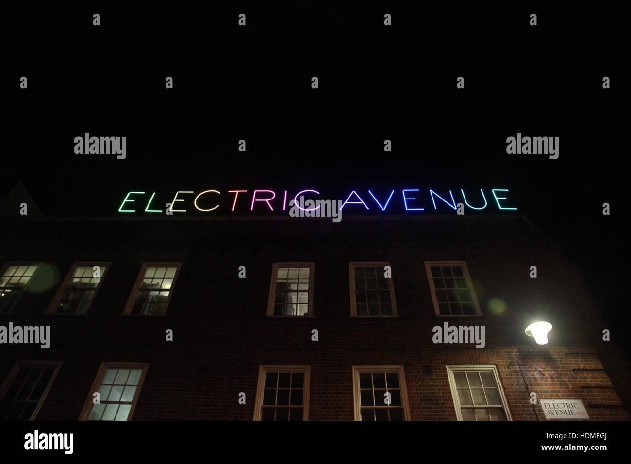 The new Electric Avenue illuminated sign, switched on by Eddy Grant, to