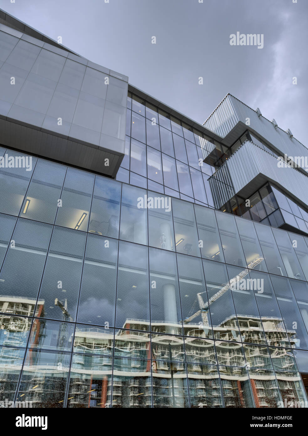 Glass Wall of a Modern Office Building with Reflection of Condo ...