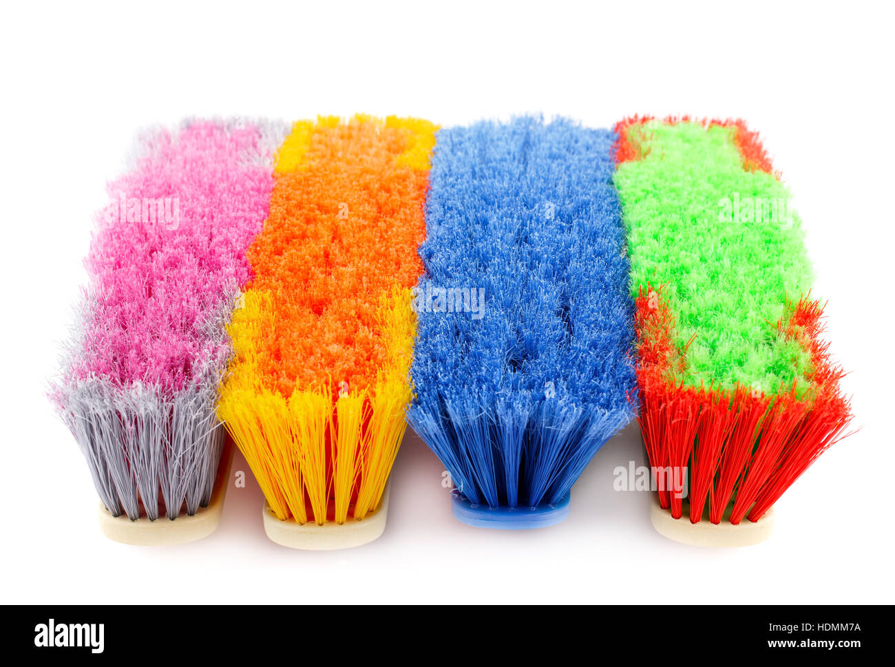 Colorful brooms isolated on white background Stock Photo - Alamy