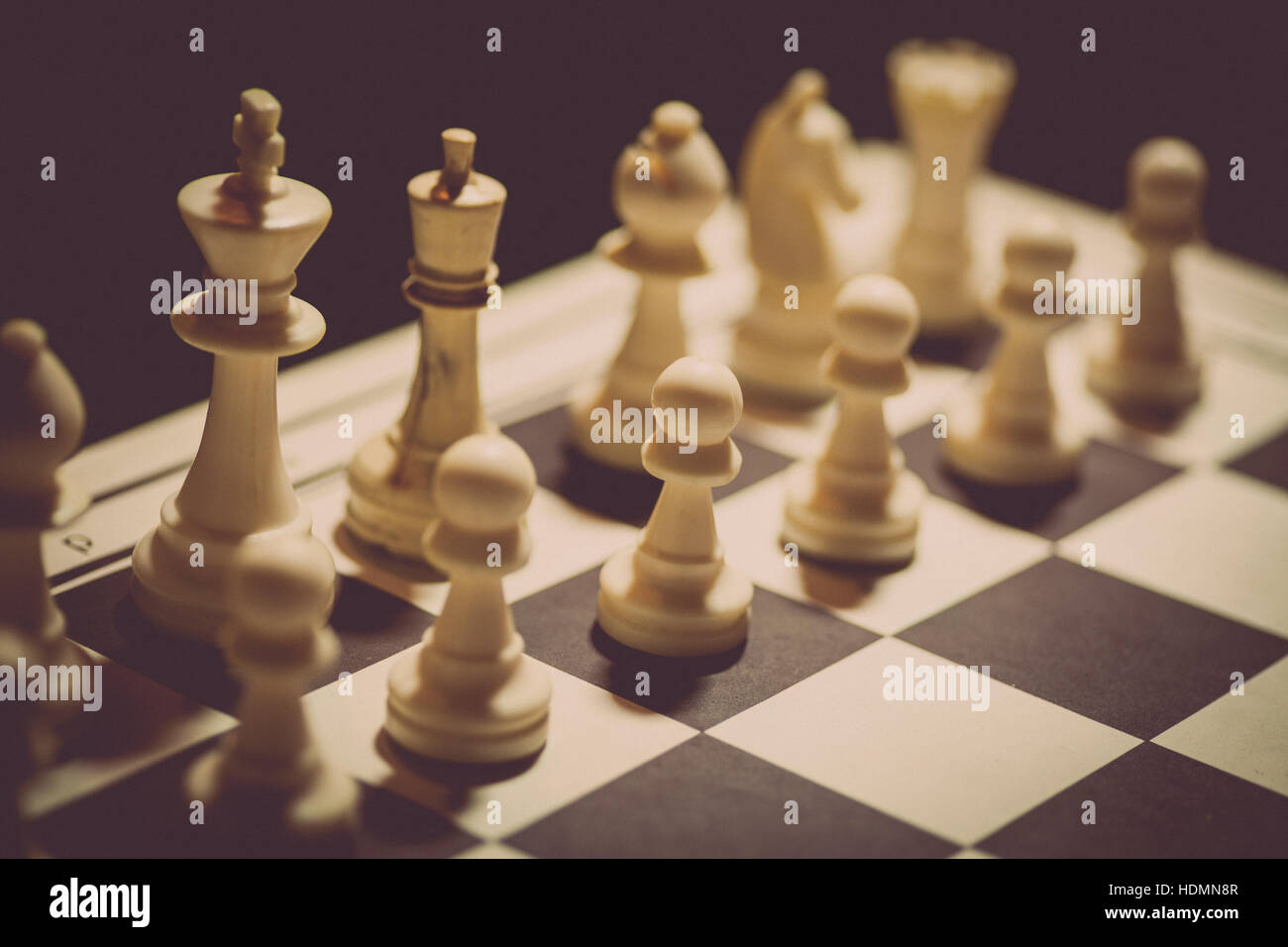 Chess pieces on a chessboard - Focus on the King Stock Photo - Alamy