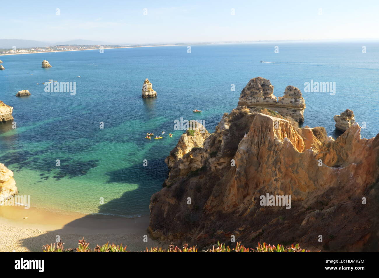 View into the ocean from above Praia do Camilo in Lagos, Portugal in summer. Stock Photo