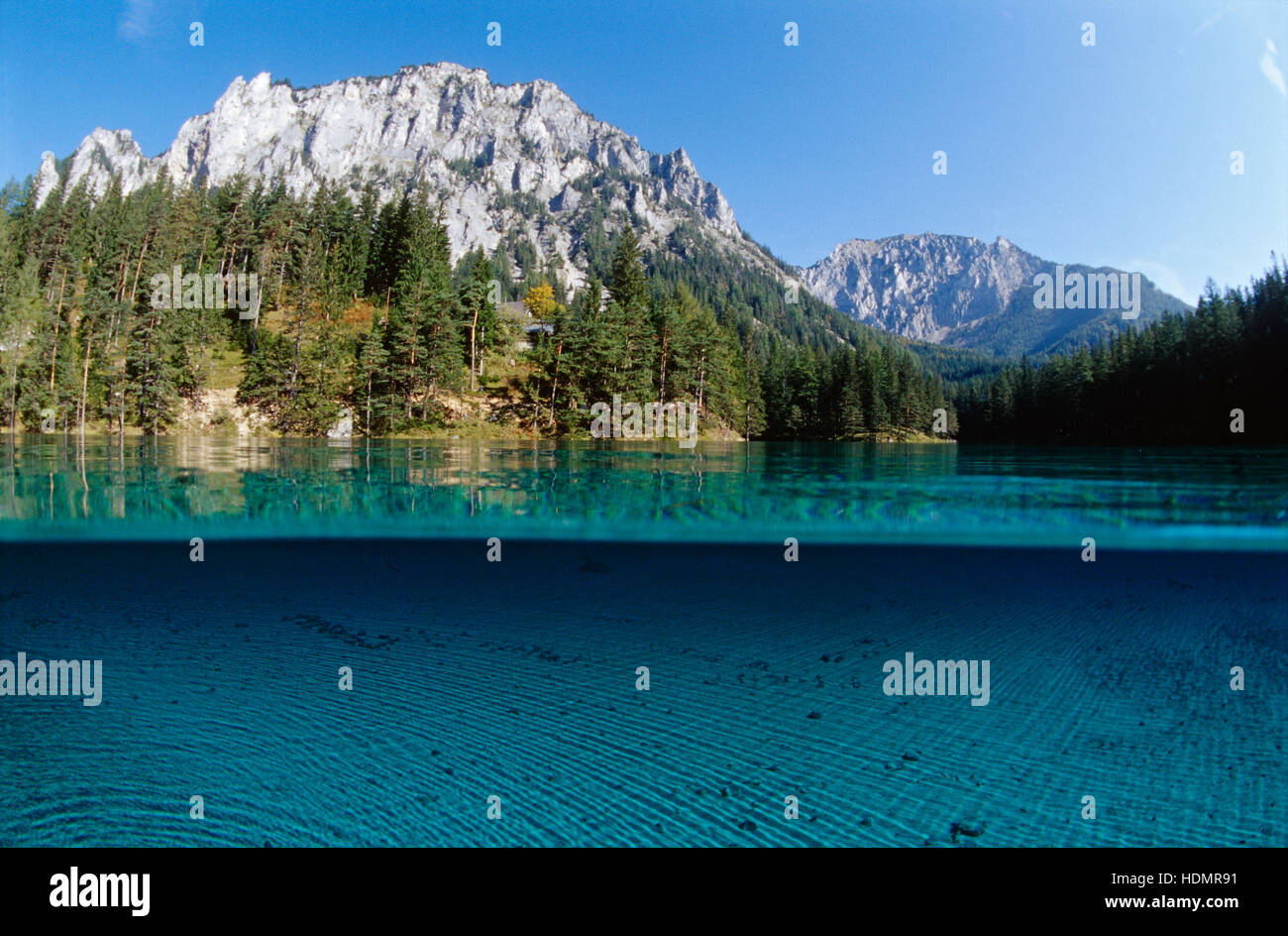 Half-half exposure of the Gruener See Lake, Pribitz Mountain of the Hochschwab Range at back, Tragoess, Styria, Austria, Europe Stock Photo