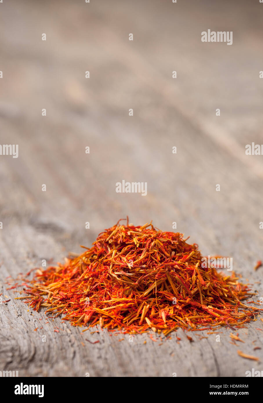 pile of saffron on the old wooden background Stock Photo
