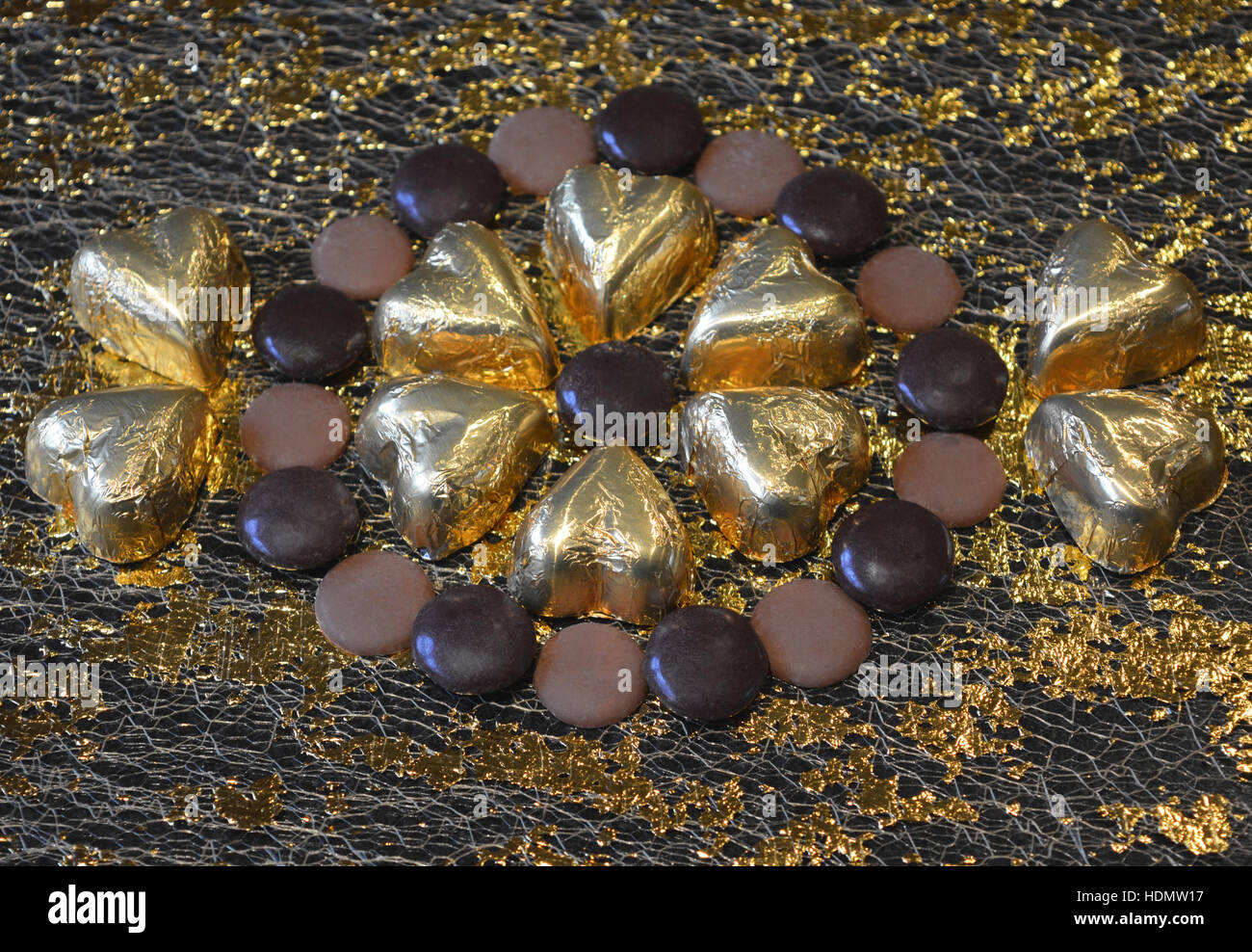 Chocolate decadence. Gold foil covered chocolate hearts with milk and