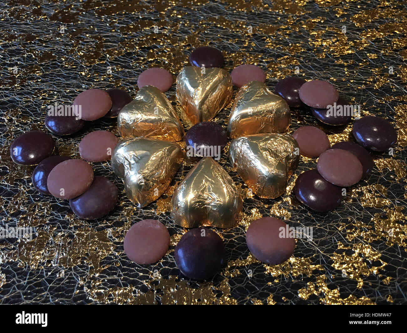 Chocolate decadence. Gold foil covered chocolate hearts with milk and