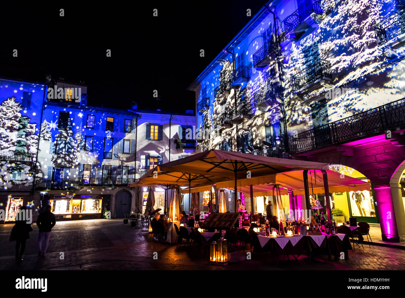 Festive Christmas decorations lights on facades of buildings on Piazza Duomo (Cathedral Square) in Como, Italy Stock Photo