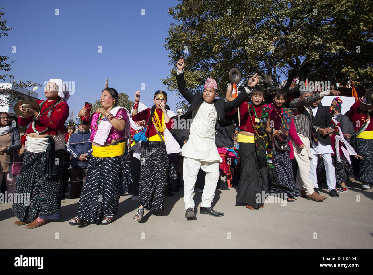 Lalitpur, Nepal. 13th Dec, 2016. Nepalese people from Kirat community in traditional costumes dance as they celebrate Udhauli festival in Lalitpur, Nepal, Dec. 13, 2016. Udhauli is the annual festival celebrated by Kirat community of eastern Nepal marking the migration of animals and birds to low altitude towards warmer regions as the winter coming. Credit:  Pratap Thapa/Xinhua/Alamy Live News Stock Photo