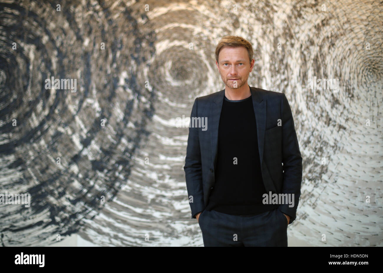 Christian Lindner, the Chairman of the liberal FDP in the state parliament of North Rhine-Westphalia and head of the party in the state, in front of a piece of art by Guenther Uecker titled 'Interferenzen' in the state parliament in Duesseldorf, Germany, 13 December 2016. Photo: Ina Fassbender/dpa Stock Photo