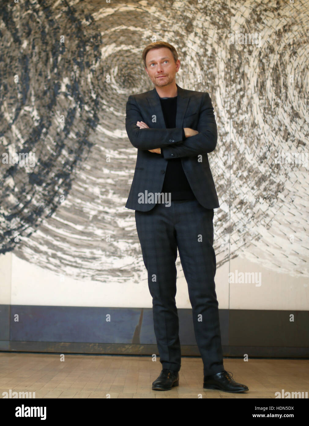 Christian Lindner, the Chairman of the liberal FDP in the state parliament of North Rhine-Westphalia and head of the party in the state, in front of a piece of art by Guenther Uecker titled 'Interferenzen' in the state parliament in Duesseldorf, Germany, 13 December 2016. Photo: Ina Fassbender/dpa Stock Photo
