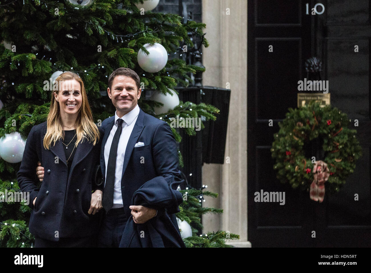 London, UK. 13th December, 2016. Helen Glover and Steve Backshall pose in front of the Downing Street Christmas tree before the Children's Christmas Party at No. 11 hosted by Chancellor of the Exchequer Philip Hammond in aid of the Starlight Children's Foundation. Credit:  Mark Kerrison/Alamy Live News Stock Photo