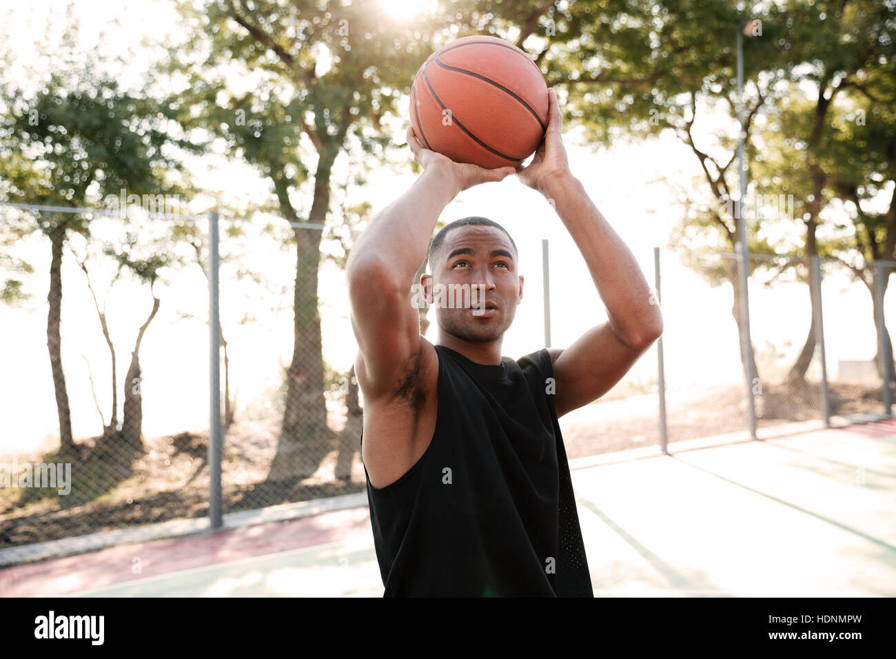 Photo Of Attractive African Basketball Player Practicing In The Street 