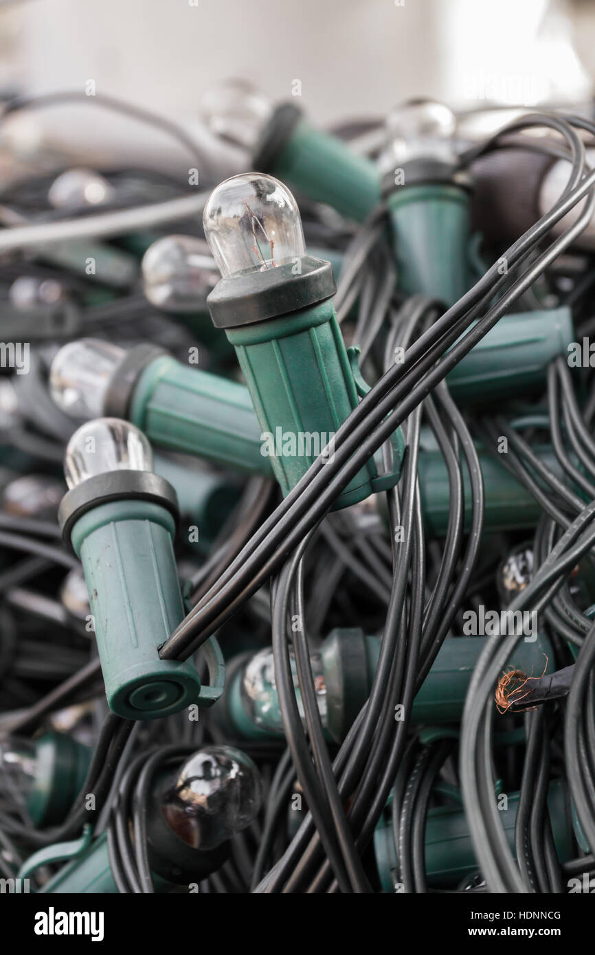 Mess of tangled oldstyle Christmas lights. Shallow depth of field