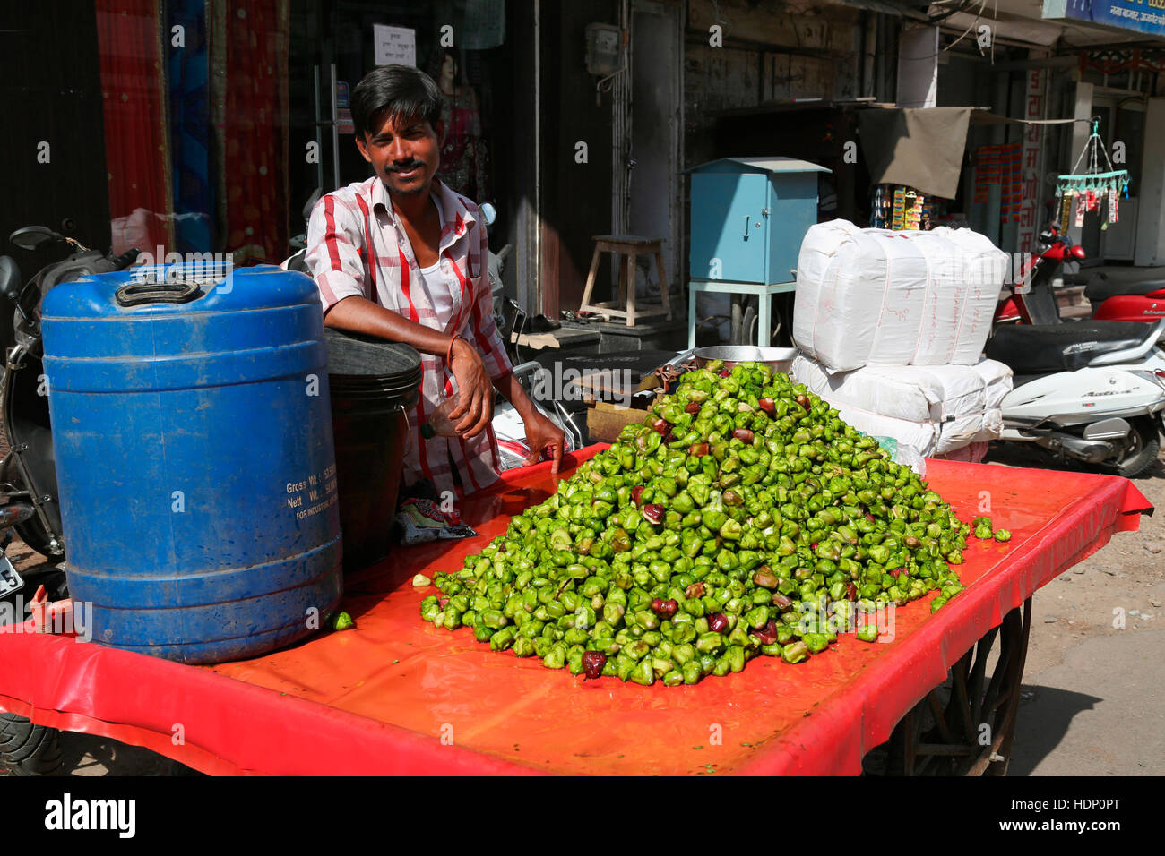 A Man Selling water caltrop or Singhara on Ajmer Street Stock Photo