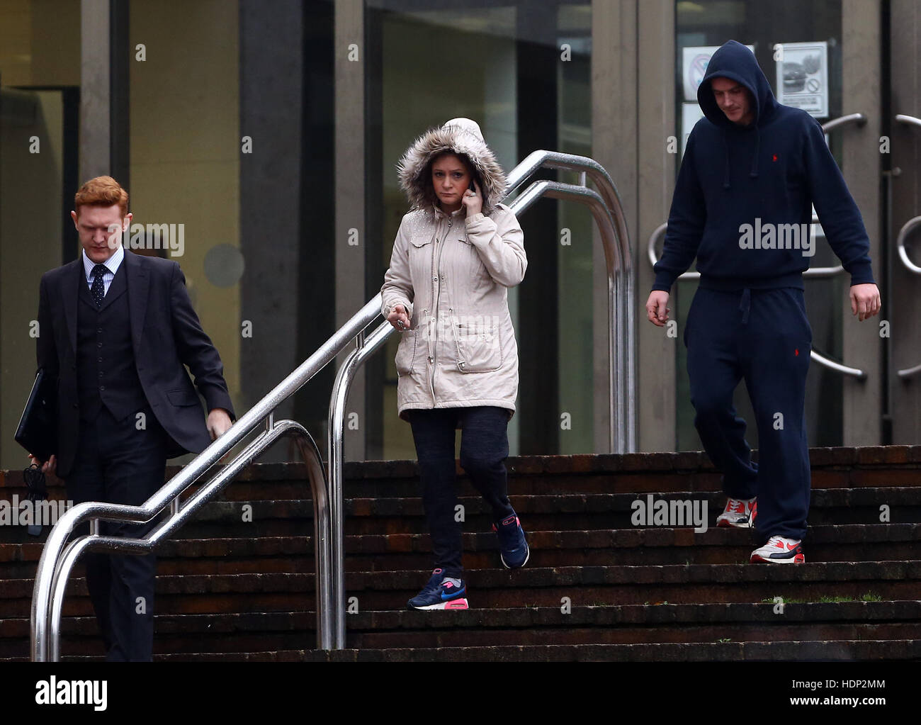 Katherine Cox (middle) and Danny Shepherd (right) leave Maidstone Crown Court after appearing charged with causing or allowing the death of a baby. Stock Photo