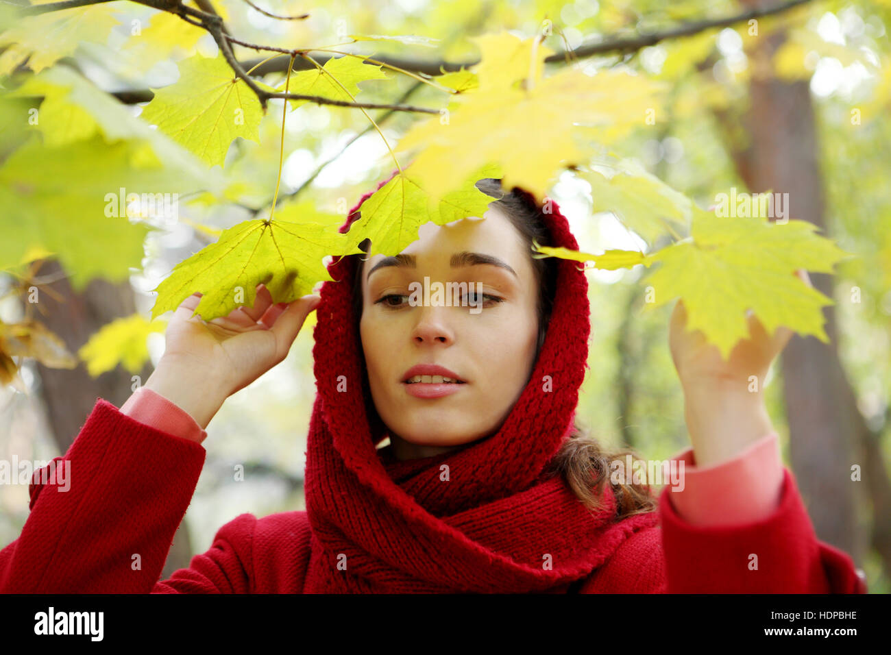 Beautiful young girl walking in autumn park Stock Photo - Alamy