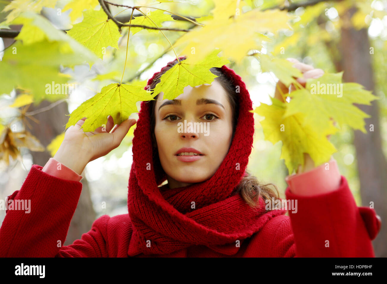 Beautiful young girl walking in autumn park Stock Photo - Alamy