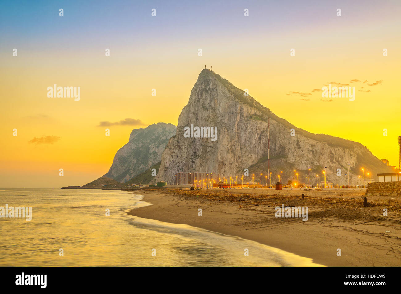 View on Gibraltar rock at sunset from beach in La Linea de la Concepcion, Andalusia, Spain Stock Photo